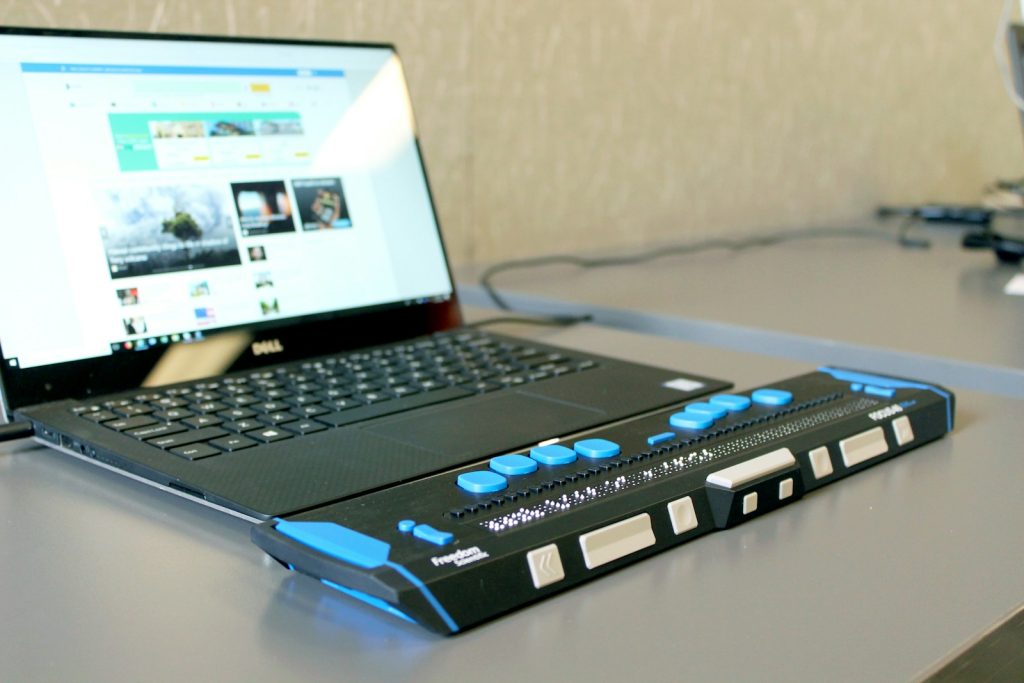 a laptop computer sitting on top of a desk